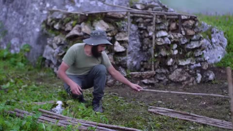 Building Bushcraft Stone Shelter in the Mountain with Grass Roof