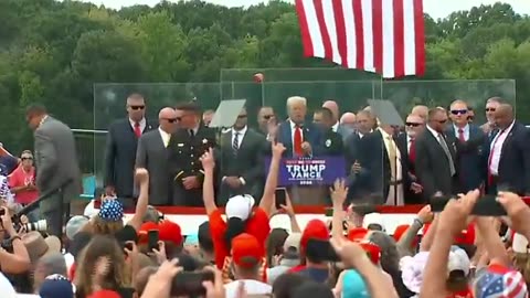 Trump speaks behind bulletproof glass in his first outdoor rally