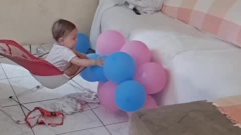 Baby Plays With Balloons