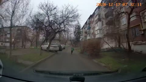 Kid Runs Out On The Street In Front Of A Car And The Driver Stops In Time - Close Call