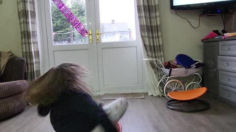 Girl Enjoys Spinning on Carousel