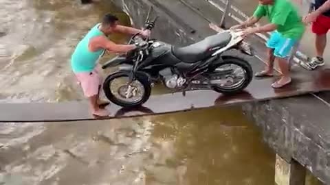 Motorcycle drop into under water