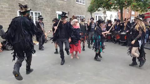 Beltane Border Morris performing Firedance at Bridport Folk Festival, Saturday 27th July 2019