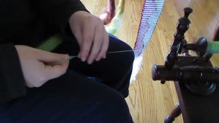 Spinning Cobwebs on an Antique Spinning Wheel