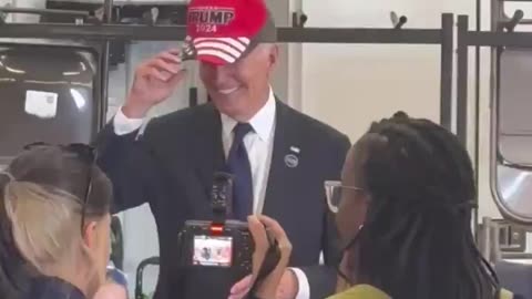 Biden Puts On A 'Trump 2024' Hat In Bizarre Video