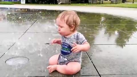 babies playing with water