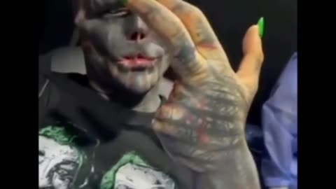 A man who is transforming himself to become a reptilian via surgery and body modifications.