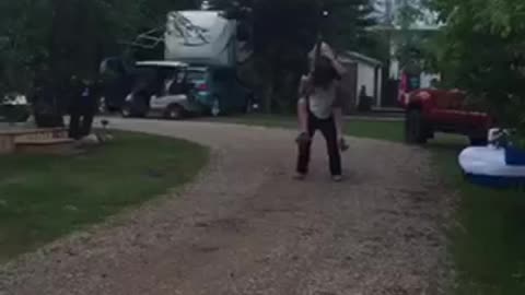 Jousting while riding on friends back using beer cans and boxes as armor