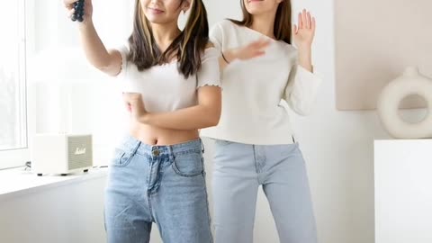 Two Young Women Making A Dance Video