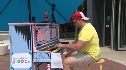 Chicago’s ‘drive-by pianist’ rolls a 600 pound piano to a corner, enticing passers-by to play