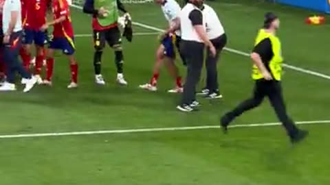 Alvaro Morata is clattered by security chasing a pitch invader