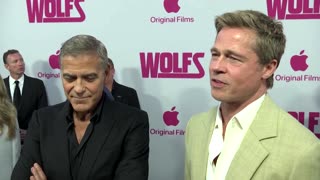 Brad Pitt, George Clooney bring their charm to 'Wolfs' premiere