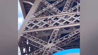 Man climbs Eiffel Tower before Olympic closing ceremony