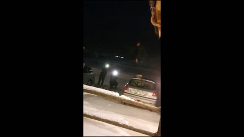 Guy on top of car slips off and falls