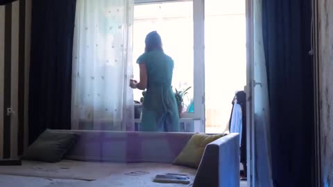 Transparent cleaning window sill With Tina in dress