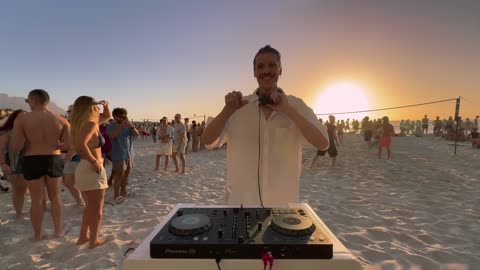 Chris Luno->playing house music on the beach until people dance