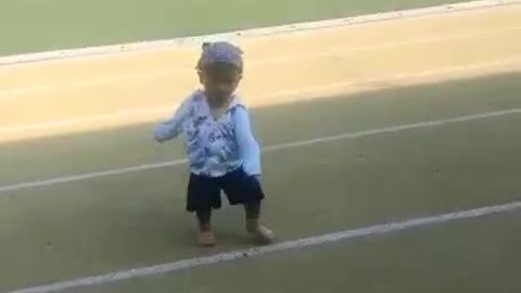 a little baby just learning to step on the earth