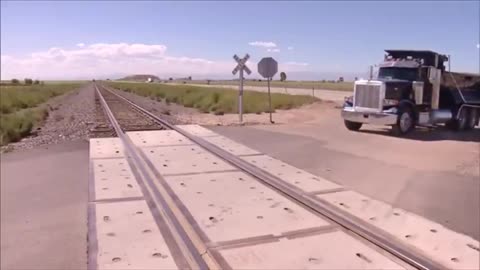 COP ARRESTS SOMEONE AND PUTS THEM IN THE COP CAR (PARKED ON THE TRAIN TRACKS). GUESS WHAT HAPPENED