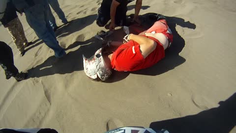 Rider Misjudges Dune Jump and Lands on Friend