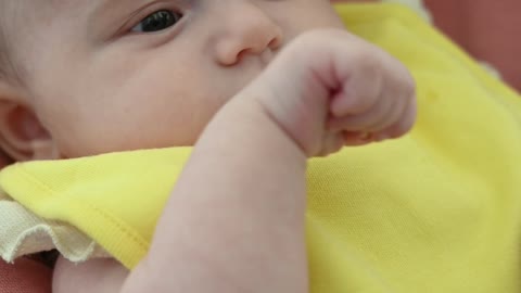 A cute baby boy playing with his mom