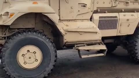 Ukrainian servicemen try to figure out how to hide NATO equipment in a shed