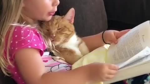 CUTE VIDEO of little girl reading to her CAT!!!!