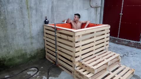 Man builds incredible homemade pallet pool all on his own