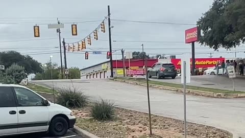 Illegals swarm a shopping center across the street is an everyday event !