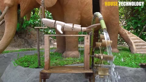 Build dog house in Elephant and build fish pond around elephant house