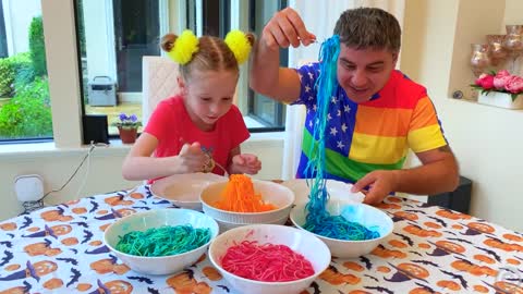 Nastya and Papa are preparing colored noodles