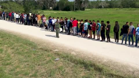 Massive line of migrants caught on video ILLEGALLY ENTERING THE UNITED STATES in Brownsville, TX