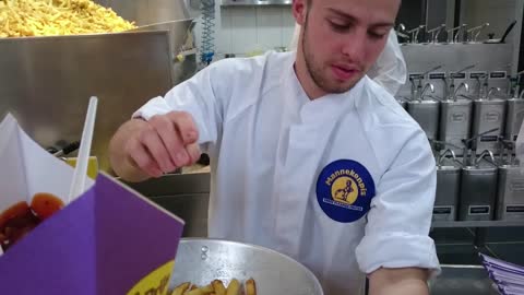 Eating Dutch Fries at Manneken Pis in Amsterdam