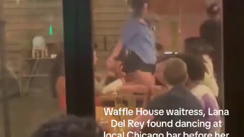 Lana Del Rey twerking on top a table in her Waffle House uniform