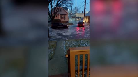 Street turns to river as flooding hits Wisconsin