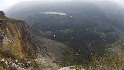 Fearless BASE jumper flies over Dolomites Alps