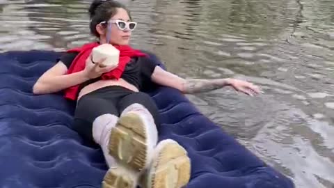 Relaxing on A Float Down A Flooded Street