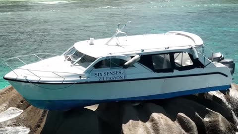 Boat Gets Bizarrely Stuck on a Rock