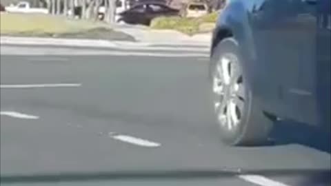 Strange Scenes as Man Hangs Onto Car Hood