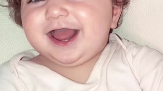 baby girl is laughing