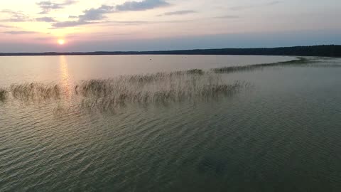 Rising Up From The Beach On Lake, Sundown