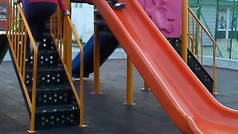 Litle girls on the slides