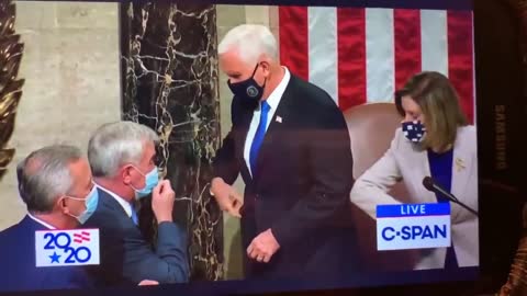 Pence receives a masonic salute.