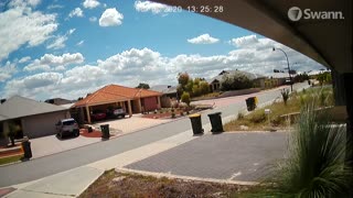 Sudden Wind Gust Throws Bins Across Street