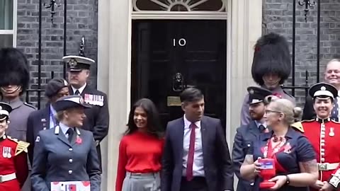 Prime Minister Rishi Sunak and his wife buy poppies outside 10 Downing Street