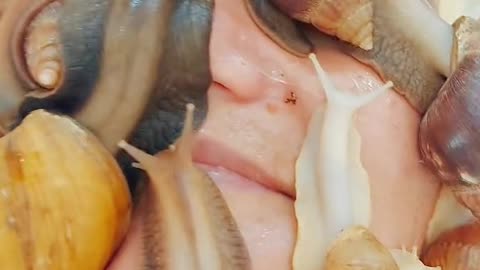 Funniest man stick snails and slugs on his face?