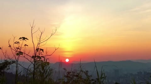 Watch the sun climb up the Gold Panning Mountain in Shaxian County, China