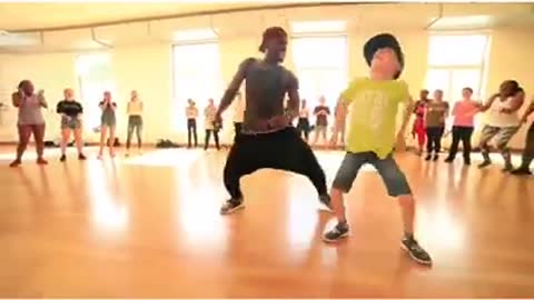 - This little white boy dancing afro