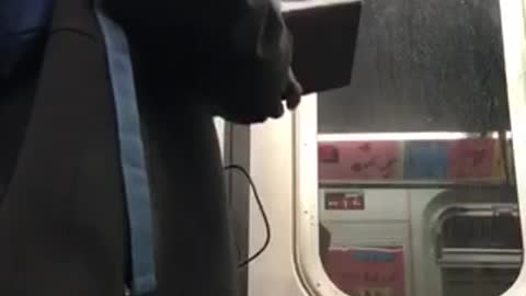 Man blue backpack and sweatpants music on subway