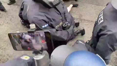 Germany: Police try to violently crush a anti lockdown protester..