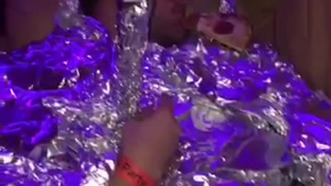 Passed out man wrapped in tin foil